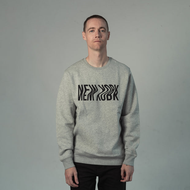 male model wearing grey New York sweatshirt by Fils Unique