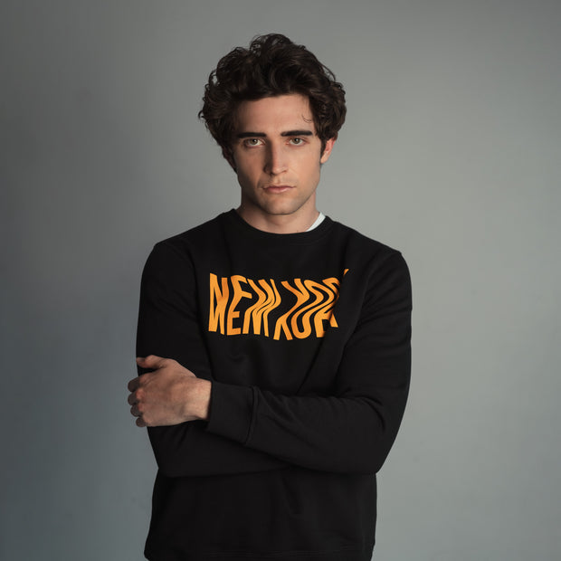 male model wearing navy Bushwick sweatshirt by Fils Unique